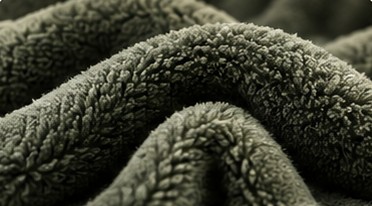 Close-up van zachte groene fleece